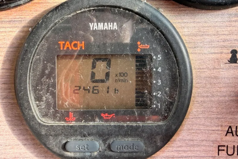 Slide: The Image of Yamaha tachometer displaying 2461 hours on a 1993 Grady-White Marlin 300 boat. - 27