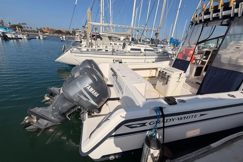 Slide: The Image of 1993 Grady-White Marlin 300 boat docked with Yamaha outboard engines. - 5
