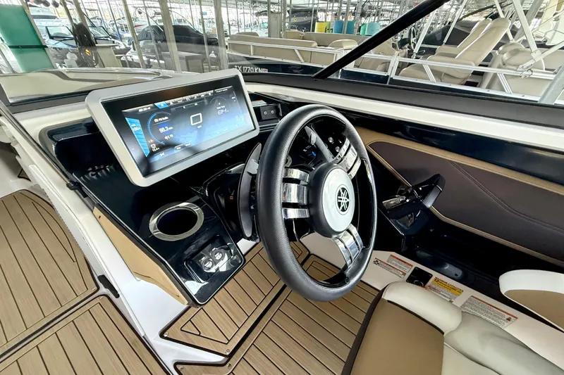 Slide: The Image of 2022 Yamaha Boats 252SD dashboard with touchscreen display and steering wheel. - 18