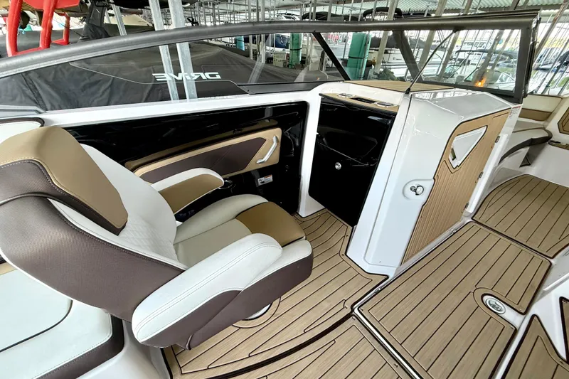 Slide: The Image of Interior of 2022 Yamaha Boats 252SD, featuring sleek seating and modern design elements. - 19