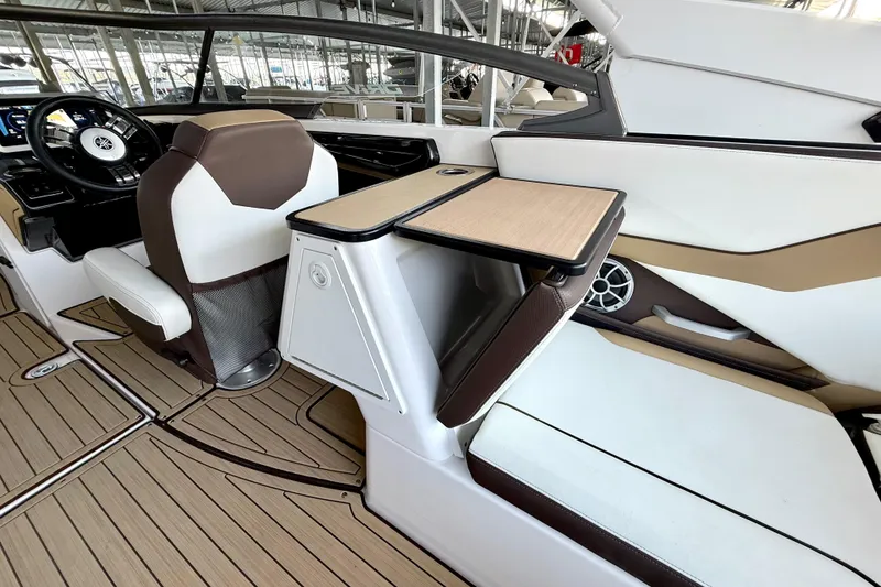 Slide: The Image of 2022 Yamaha Boats 252SD interior with sleek seating and modern dashboard design. - 21