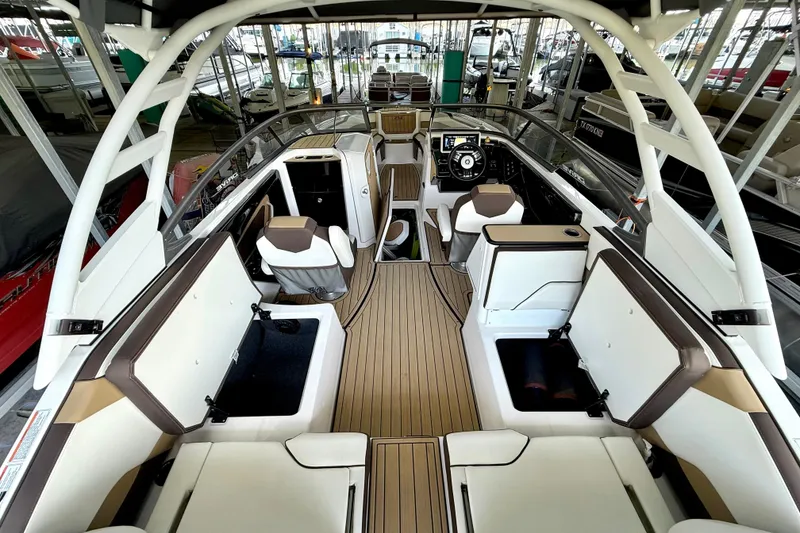 Slide: The Image of 2022 Yamaha Boats 252SD interior with sleek seating and modern dashboard design. - 24