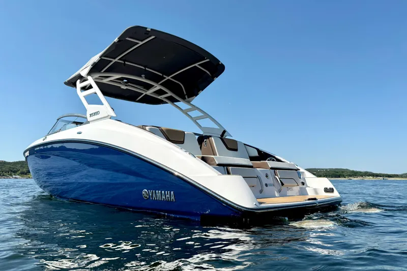 Slide: The Image of 2022 Yamaha Boats 252SD on water, featuring sleek design and spacious deck. - 7
