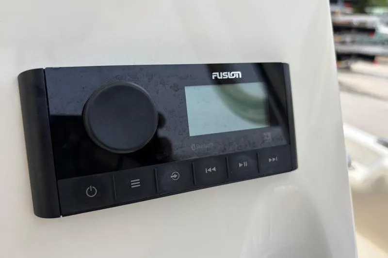 Slide: The Image of Fusion audio system on 2024 Key West 203 FS boat dashboard. - 32