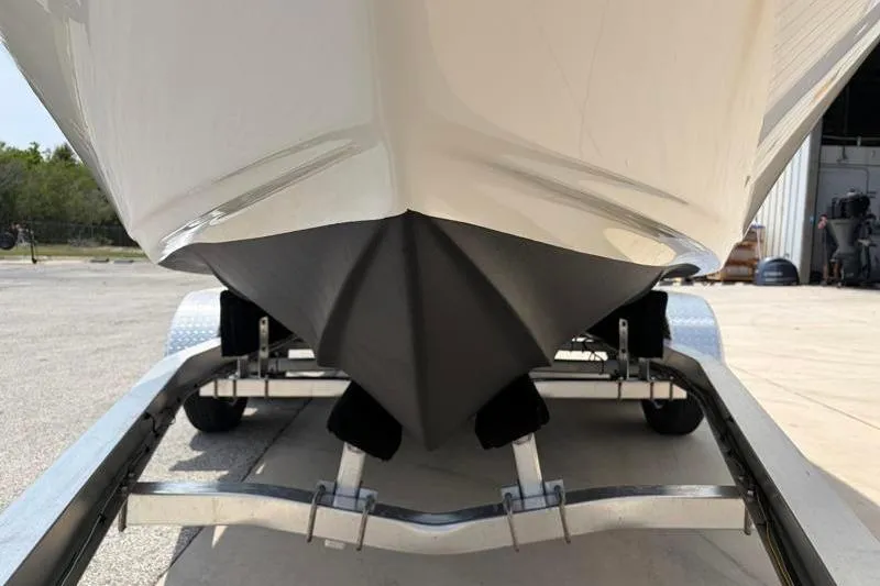 Slide: The Image of 2024 Key West 203 FS boat on trailer, showcasing sleek hull design. - 12