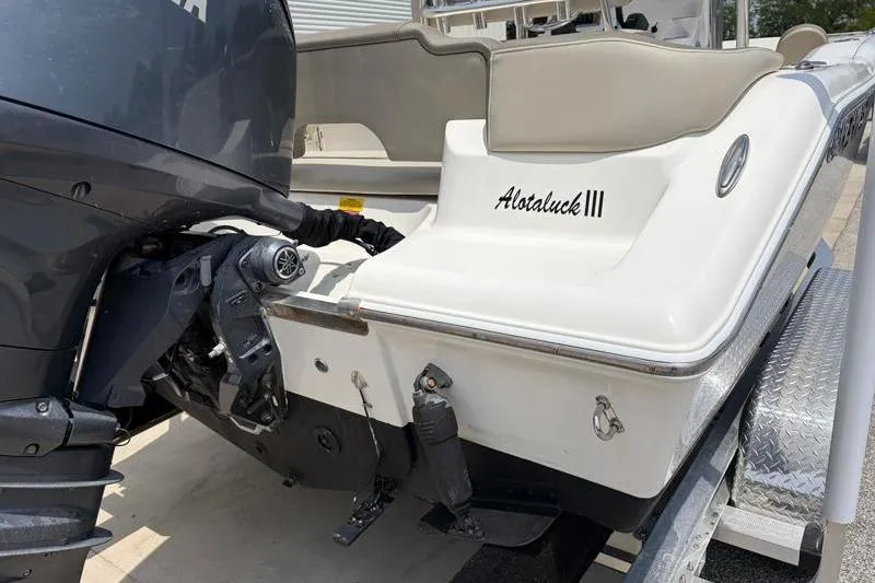 Slide: The Image of 2024 Key West 203 FS boat rear view with motor and trailer. - 15