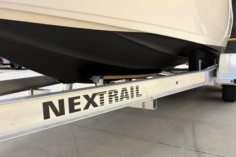 Slide: The Image of 2024 Key West 203 FS boat on a NexTrail trailer, close-up view. - 45