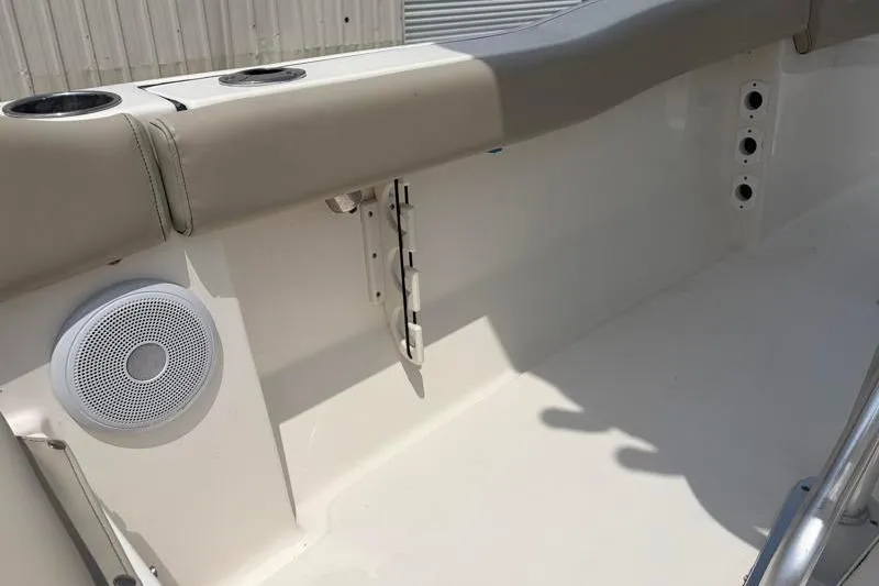 Slide: The Image of 2024 Key West 203 FS boat interior with speaker and cup holders. - 41