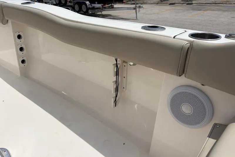 Slide: The Image of Interior view of 2024 Key West 203 FS boat, featuring cup holders and speaker. - 42
