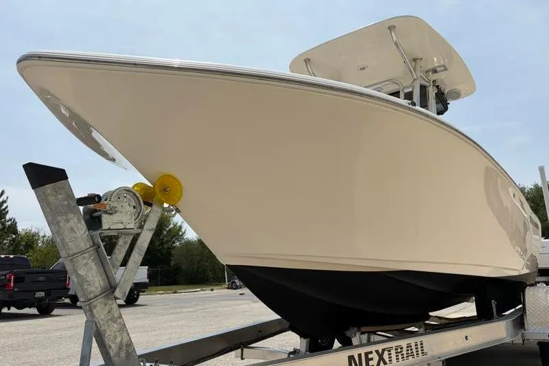 Slide: The Image of 2024 Key West 203 FS boat on trailer, showcasing sleek design and sturdy build. - 11