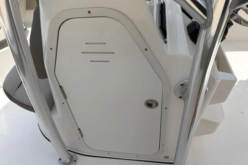 Slide: The Image of 2024 Key West 203 FS boat console with storage compartment and sleek design. - 28
