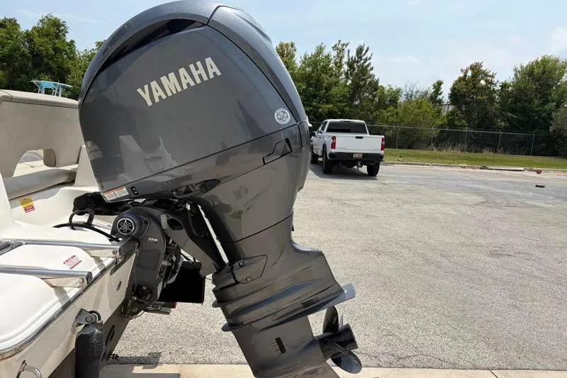 Slide: The Image of 2024 Key West 203 FS boat with Yamaha outboard motor in parking lot. - 16
