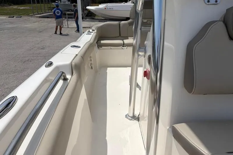 Slide: The Image of 2024 Key West 203 FS boat interior with seating and stainless steel railings. - 26