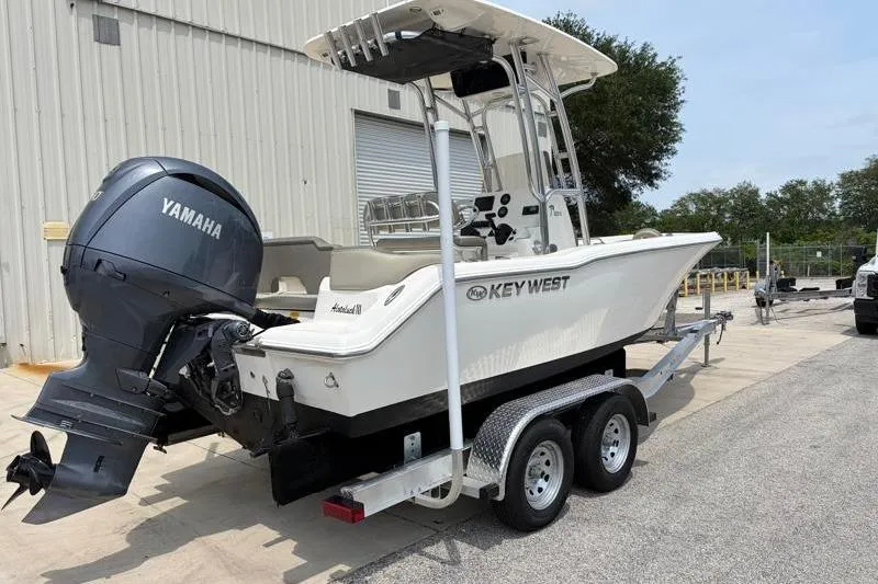 Slide: The Image of 2024 Key West 203 FS boat with Yamaha engine on trailer. - 3