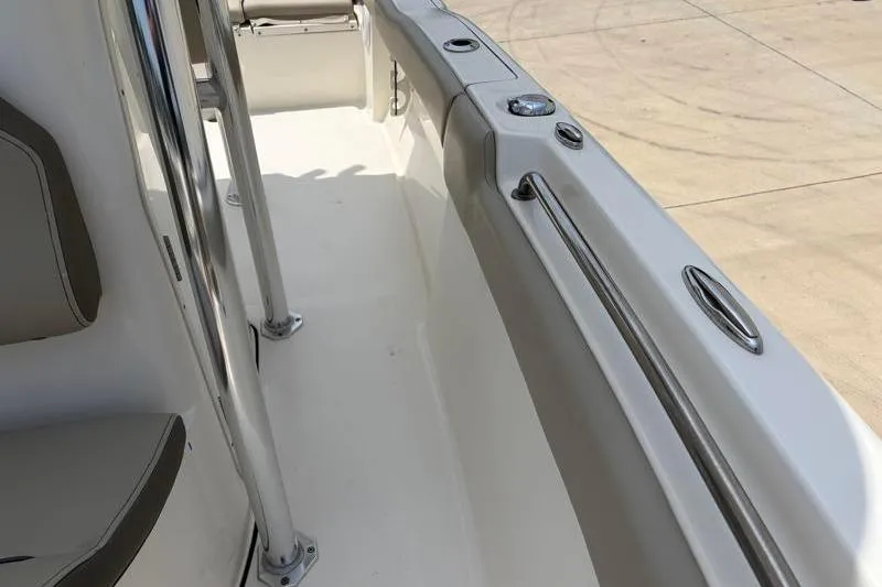 Slide: The Image of 2024 Key West 203 FS boat interior with sleek seating and stainless steel fittings. - 27