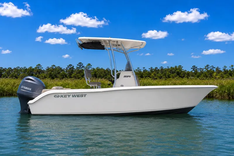 The Image of 2024 Key West 203 FS boat on water, clear sky, Yamaha engine visible. - 0