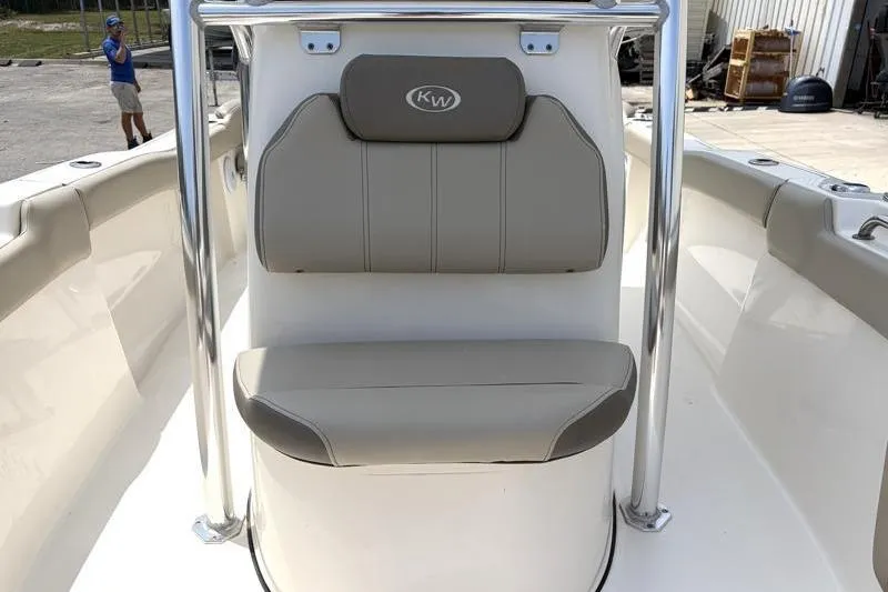 Slide: The Image of 2024 Key West 203 FS boat interior with cushioned seating and stainless steel railings. - 24