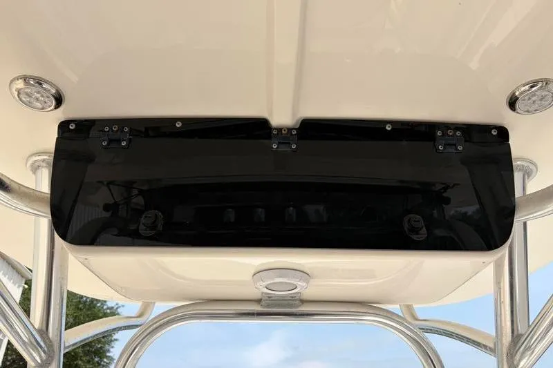 Slide: The Image of 2024 Key West 203 FS boat console with black panel and mounted lights. - 35