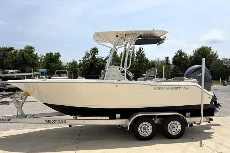 Slide: The Image of 2024 Key West 203 FS boat on trailer, parked outdoors. - 5