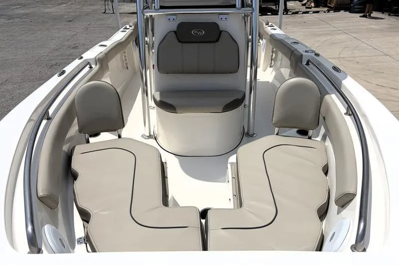 Slide: The Image of 2024 Key West 203 FS boat interior with beige seating and stainless steel accents. - 8