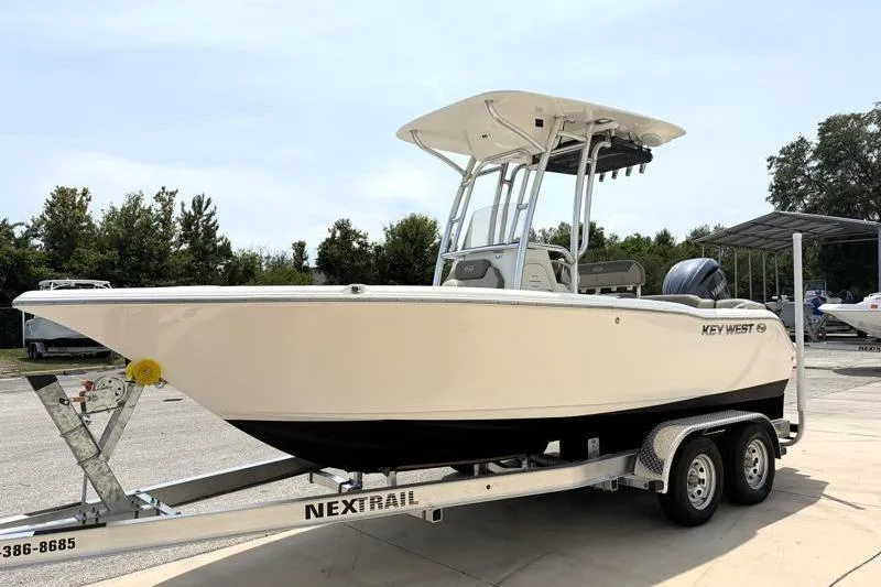 Slide: The Image of 2024 Key West 203 FS boat on trailer, parked outdoors. - 4