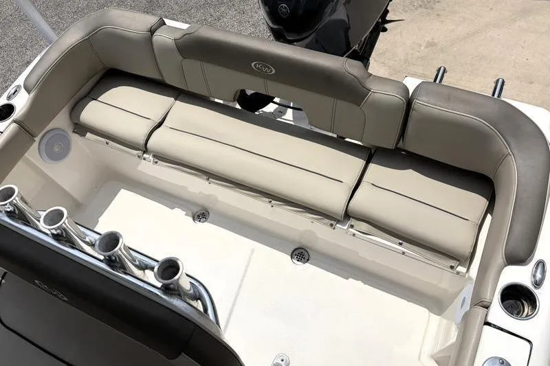 Slide: The Image of 2024 Key West 203 FS boat interior with cushioned seating and rod holders. - 37