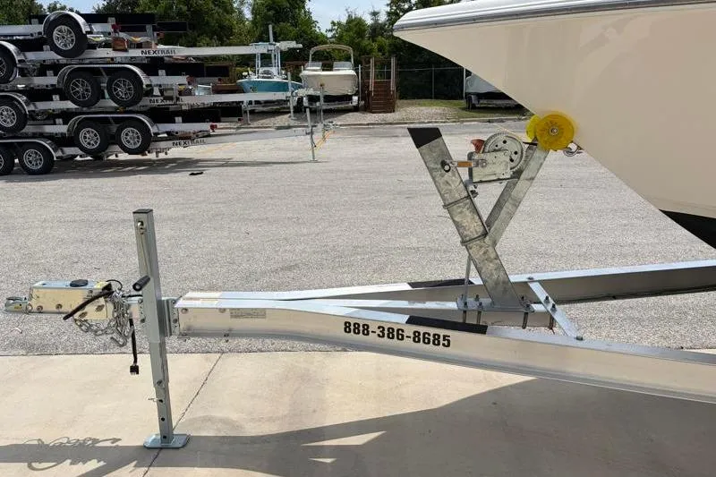 Slide: The Image of Trailer hitch of 2024 Key West 203 FS boat in parking lot. - 44
