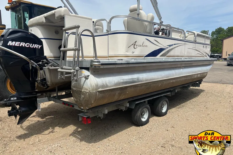 Slide: The Image of 2008 Avalon Paradise 20' pontoon boat on trailer with Mercury outboard motor. - 1