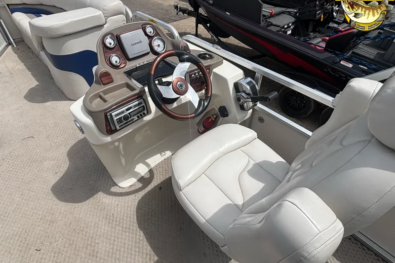 Slide: The Image of 2008 Avalon Paradise 20' boat interior with steering wheel and control panel. - 6