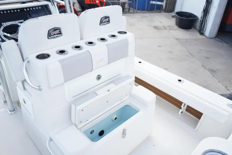 Slide: The Image of 2021 Ranger 2600 Bay boat interior with seating and storage compartments. - 11