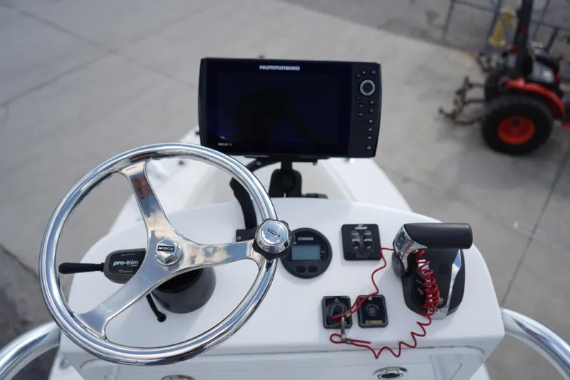 Slide: The Image of Steering console of 2021 Ranger 2600 Bay boat with navigation equipment. - 16