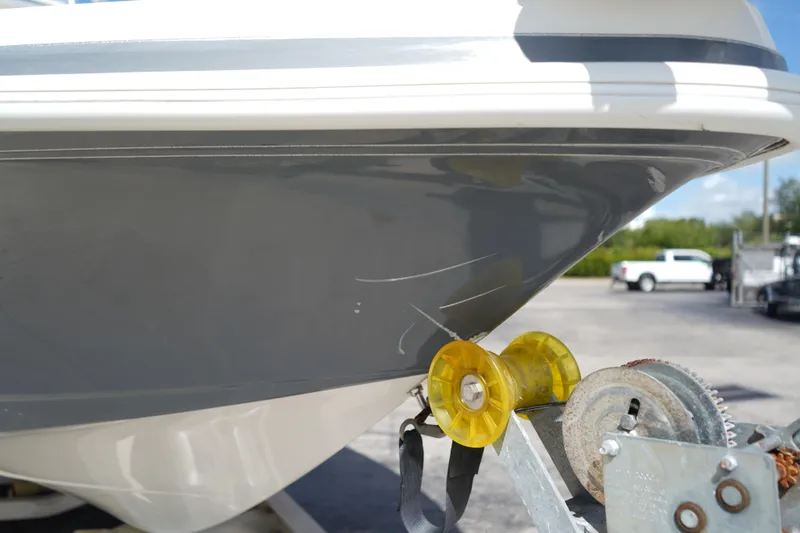 Slide: The Image of 2021 Ranger 2600 Bay boat on trailer, showing hull and winch detail. - 18
