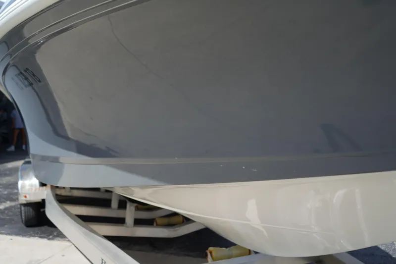 Slide: The Image of 2021 Ranger 2600 Bay boat on trailer, showcasing sleek hull design. - 19