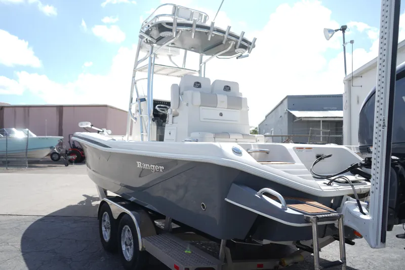 Slide: The Image of 2021 Ranger 2600 Bay boat on trailer, featuring sleek design and modern amenities. - 3