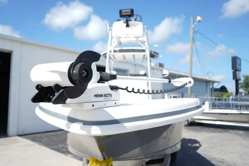 Slide: The Image of 2021 Ranger 2600 Bay boat with Minn Kota Terrova trolling motor, parked outdoors. - 5