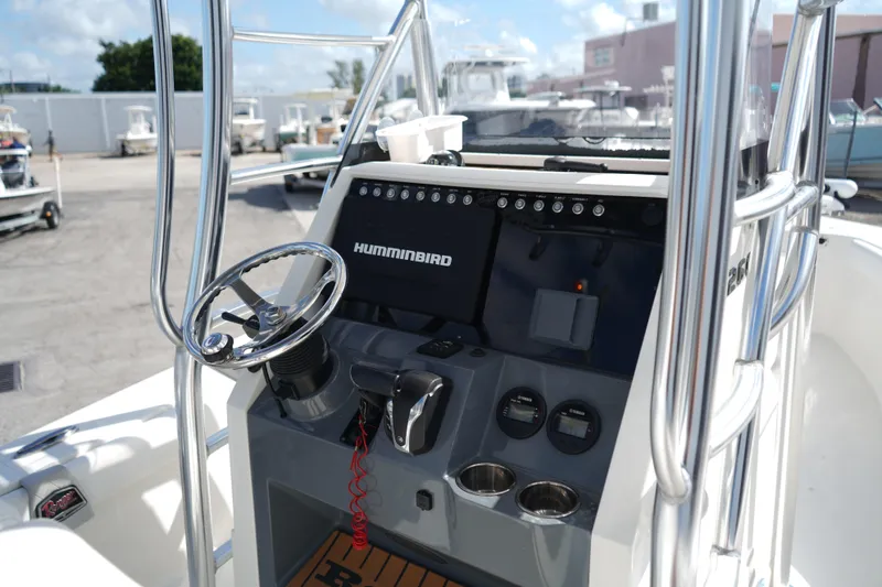 Slide: The Image of 2021 Ranger 2600 Bay boat console with steering wheel and Humminbird electronics. - 6