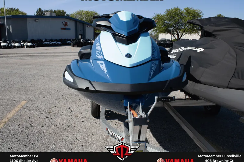 Slide: The Image of 2026 Yamaha WaveRunner VX Cruiser in blue, parked on a trailer at a dealership. - 2