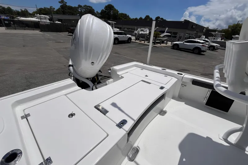 Slide: The Image of Tidewater 2300 Carolina Bay 2026 with outboard motor in parking lot. - 5