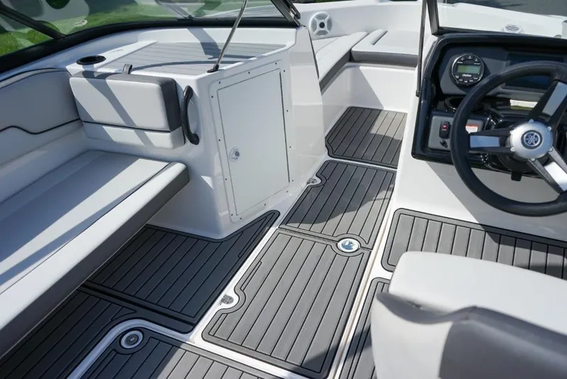 Slide: The Image of 2019 Yamaha Boats AR190 interior with sleek seating and modern dashboard design. - 13