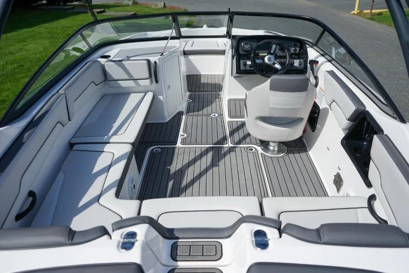Slide: The Image of 2019 Yamaha Boats AR190 interior with sleek seating and modern dashboard design. - 7