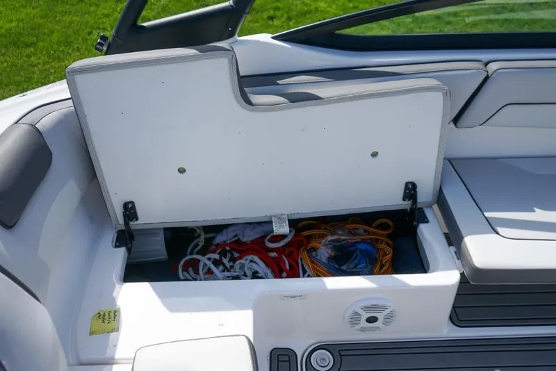 Slide: The Image of 2019 Yamaha Boats AR190 storage compartment with ropes and accessories. - 9