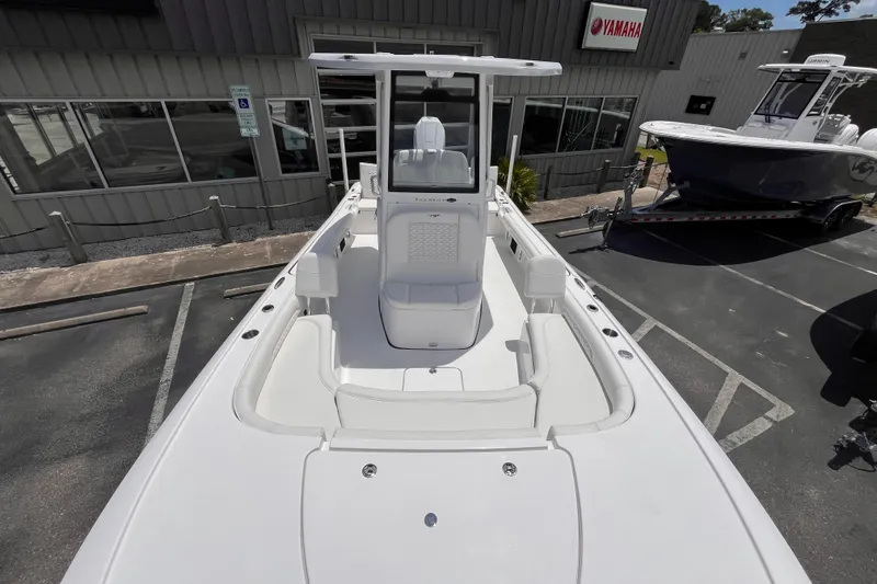 Slide: The Image of 2026 Tidewater 2500 Carolina Bay boat displayed at a dealership with Yamaha signage. - 10