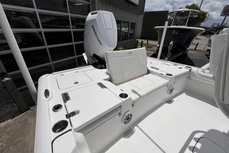 Slide: The Image of 2026 Tidewater 2500 Carolina Bay boat with Mercury engine, featuring spacious seating and storage. - 4