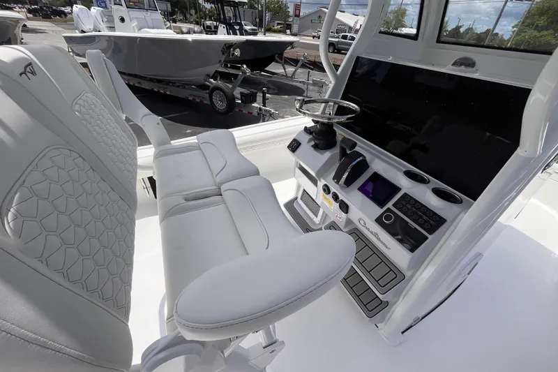 Slide: The Image of Interior view of 2026 Tidewater 2500 Carolina Bay boat with modern helm and seating. - 6