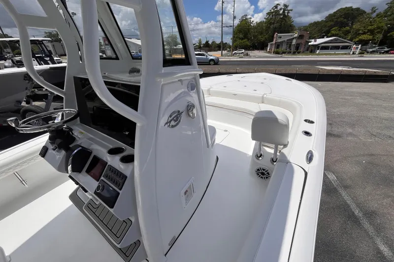 Slide: The Image of 2026 Tidewater 2500 Carolina Bay boat interior with steering console and seating. - 8