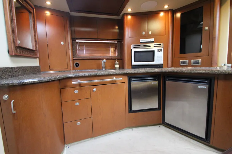 Slide: The Image of Luxurious kitchen interior of 2007 Sea Ray 44 Sundancer yacht with modern appliances. - 41