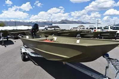 Slide: The Image of 2024 Lowe L1648M Aura Jon boat on trailer, outdoor display with mountains in background. - 3
