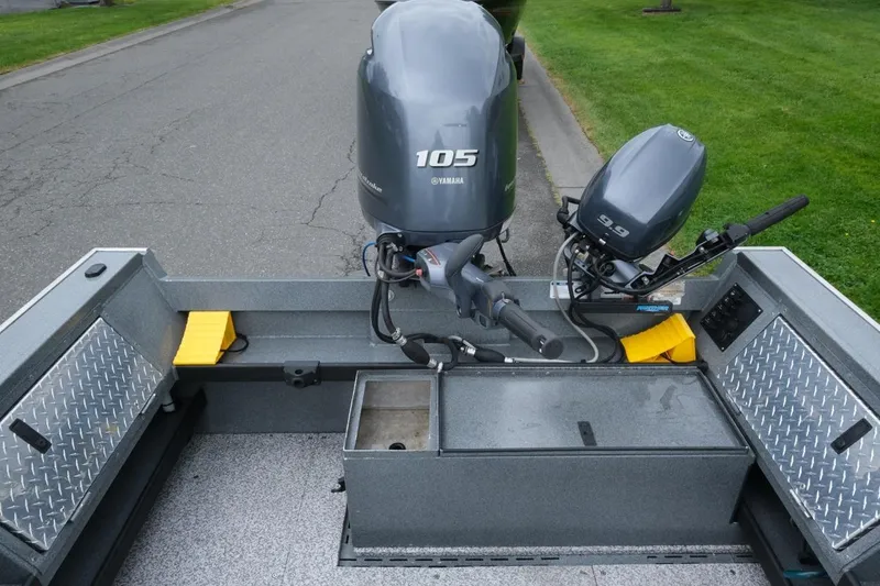 Slide: The Image of 2021 Alumaweld Super Vee 20 boat with dual Yamaha outboard motors on a paved road. - 11