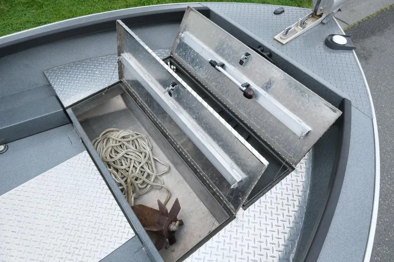 Slide: The Image of 2021 Alumaweld Super Vee 20 boat storage compartment with rope and anchor. - 12