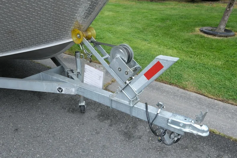 Slide: The Image of Trailer hitch of a 2021 Alumaweld Super Vee 20 boat on pavement. - 14